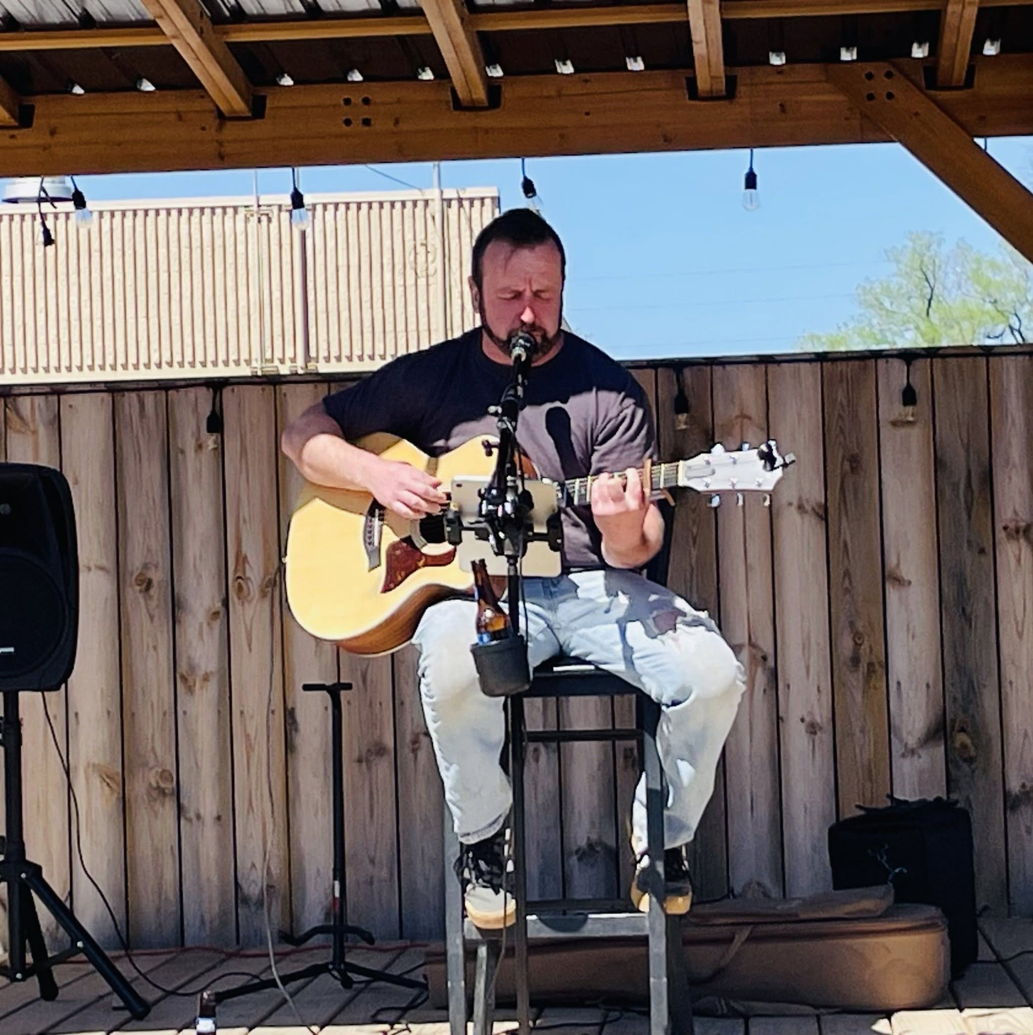 James Crosby singing and playing acoustic guitar live
